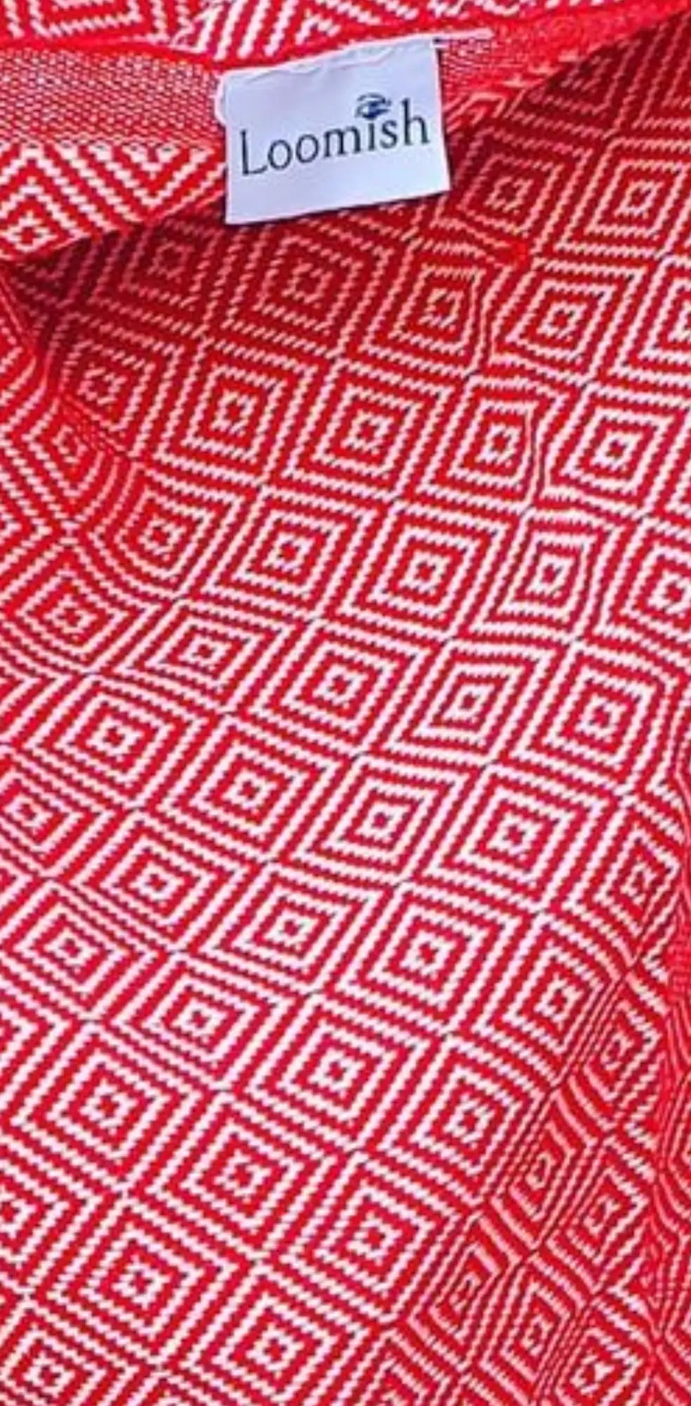 Red cotton label with a geometric white pattern, featuring a small white tag with "Loomish" logo at the top.
