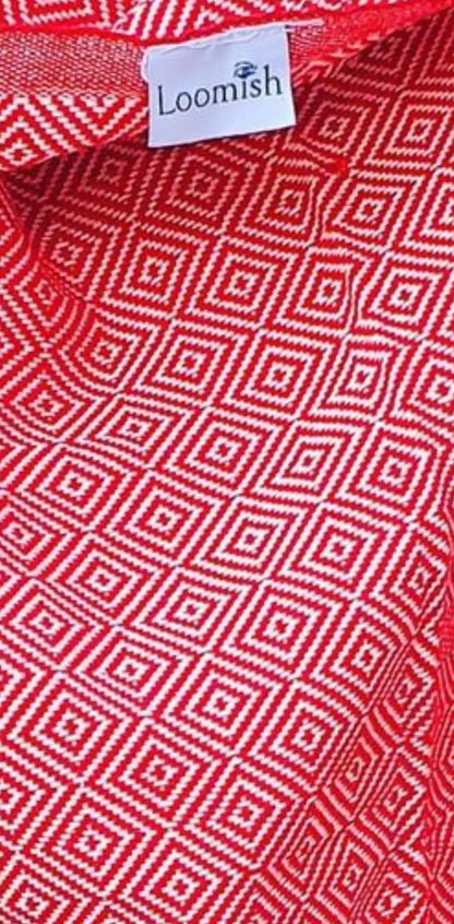 Red cotton label with a geometric white pattern, featuring a small white tag with "Loomish" logo at the top.