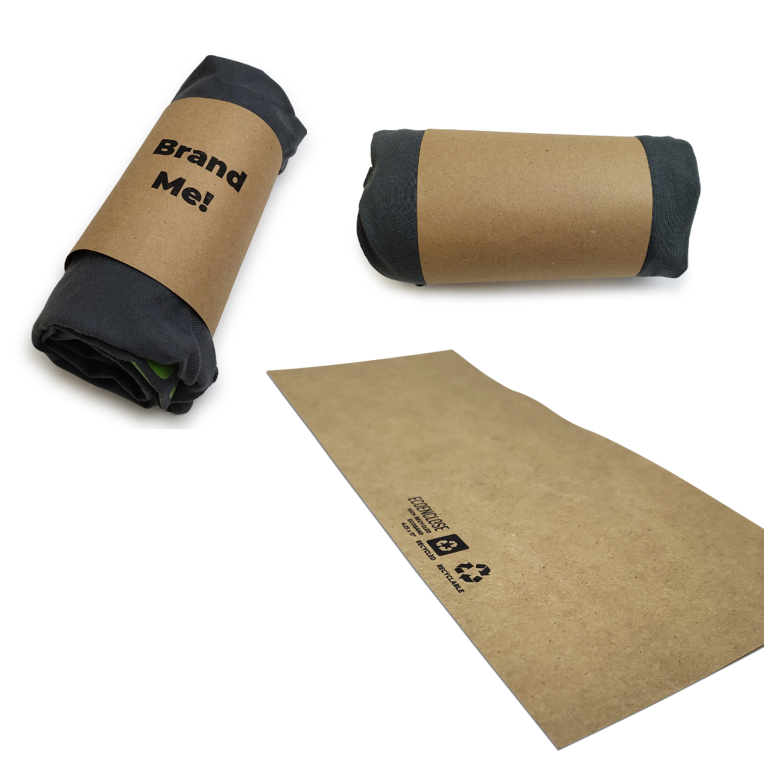 "Two rolled black t-shirts wrapped with brown paper labels, one label reads 'Brand Me!' in bold black text."